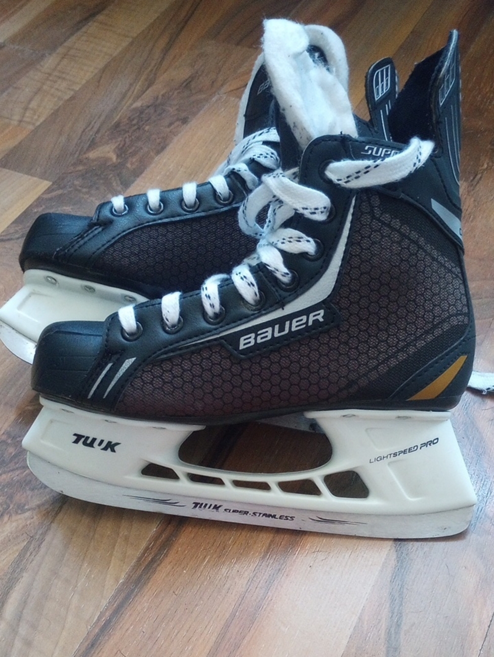 Bauer Black and White Ice Hockey Skates with Gold Accent